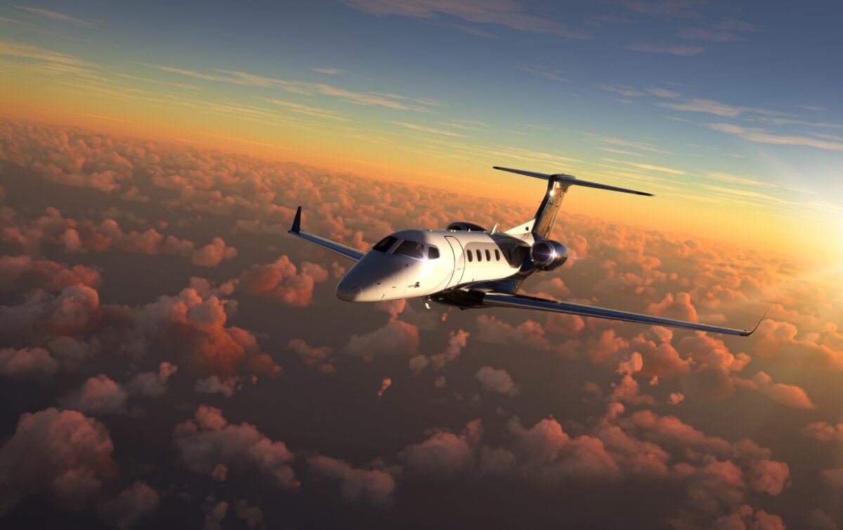 Private,Jet,Flying,Over,Amazing,Sunset